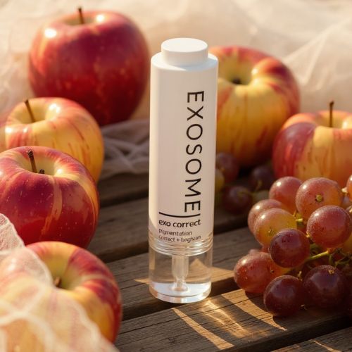 Exosome exo correct skincare bottle with apples and grapes on a wooden surface by skin-rg