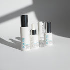 Set of skincare products from SKIN-RG on a light surface with a neutral background