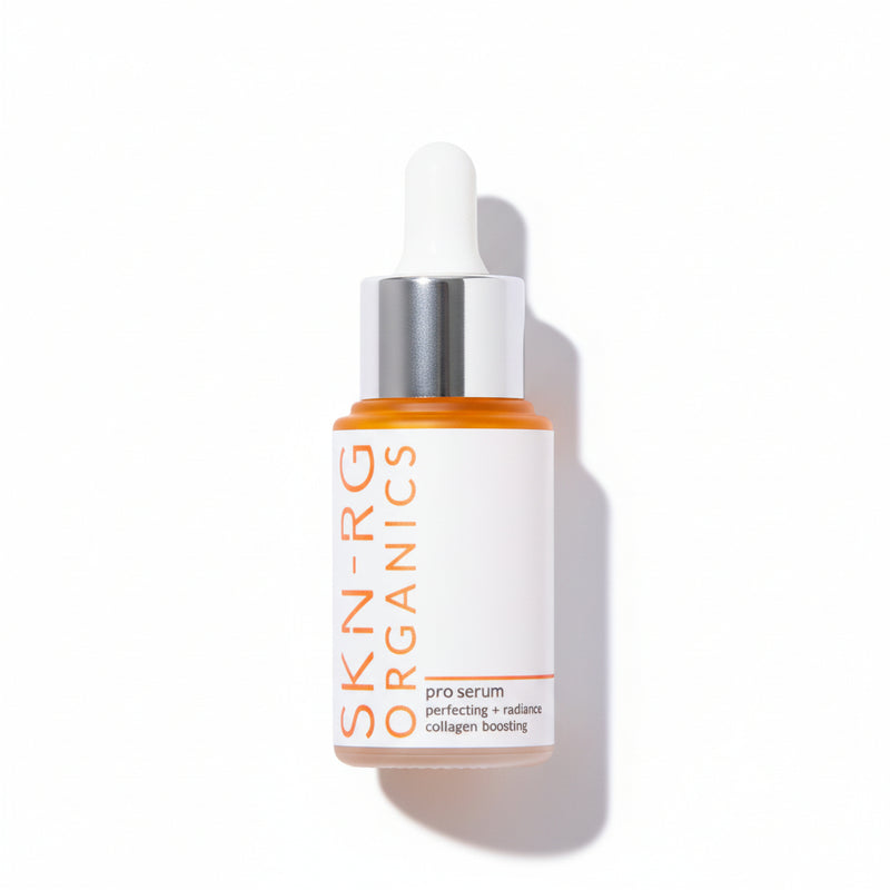 Skin-rg Skincare pro serum bottle with dropper and flower petals on a white background