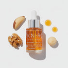 Video Skin-rg Skincare pro oil bottle with dropper and flower petals on a white background