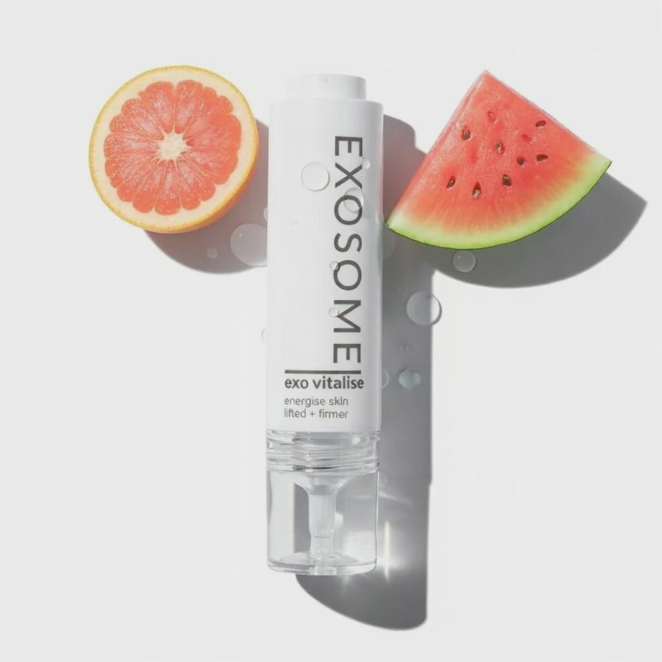 Exo Vitalise lift firming exosomes serum bottle with grapefruit and watermelon slices on white background by www.skin-rg.com