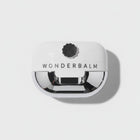 Video of Wonderbalm the reconstructor for damaged skin product on a white background with petals falling on to the jar by skin-rg