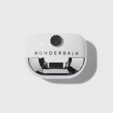 Video of Wonderbalm the reconstructor for damaged skin product on a white background with petals falling on to the jar by skin-rg