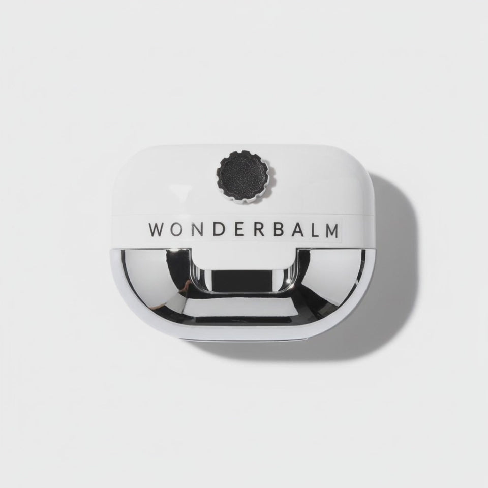 Video of Wonderbalm the reconstructor for damaged skin product on a white background with petals falling on to the jar by skin-rg