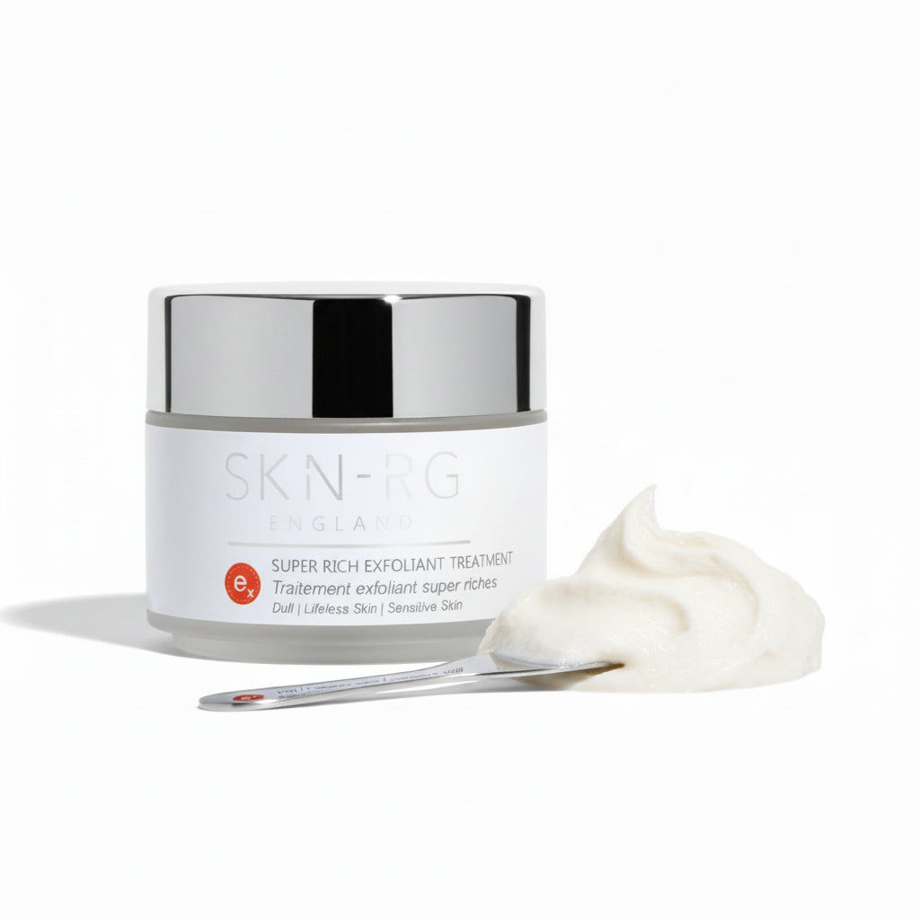 Skin-rg Organics Super Rich Exfoliant Treatment texture shot with Reishi Mushroom and black cohosh on white background and jojoba spheres.