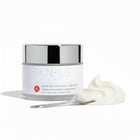 Skin-rg Organics Super Rich Exfoliant Treatment texture shot with Reishi Mushroom and black cohosh on white background and jojoba spheres.