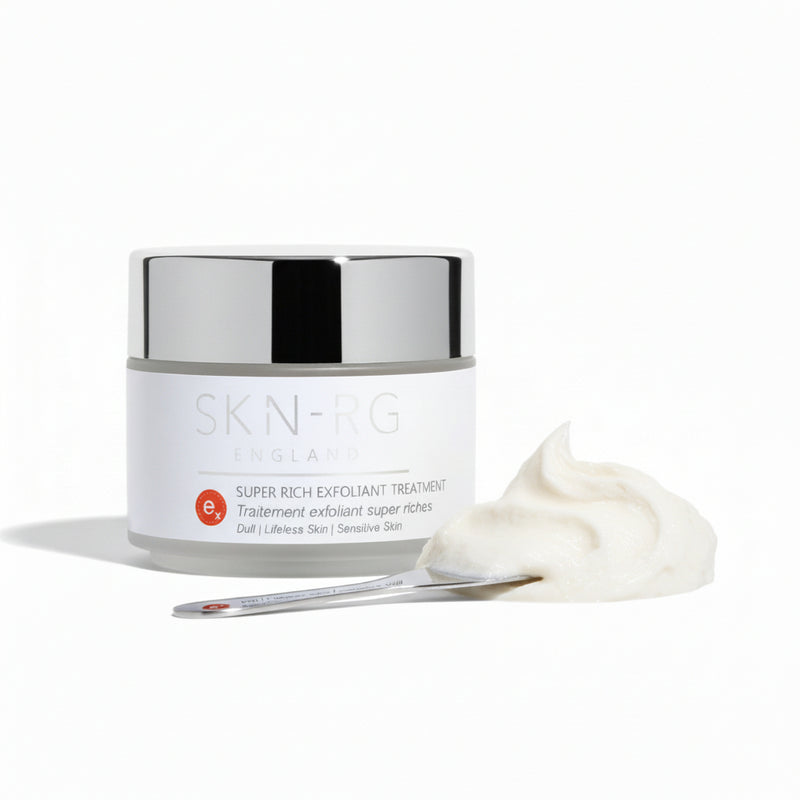 Skin-rg Organics Super Rich Exfoliant Treatment texture shot with Reishi Mushroom and black cohosh on white background and jojoba spheres.