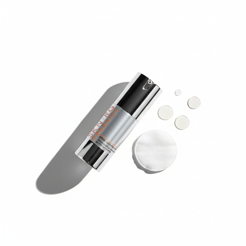 Skin-rg Skincare Skincare Cellular Balance Toner bottle with silver cap on a white background 30ml with toner pad and droplets.