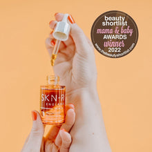 www.skin-rg.com Pro Oil Concentrate serum in a glass dropper bottle, featuring a golden oil and a 'Mama & Baby Awards Winner 2022' badge.