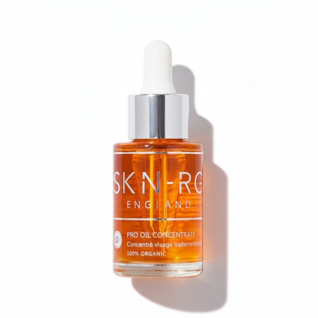 www.skin-rg.com Pro Oil Concentrate serum in a clear glass bottle with a white dropper. The amber oil is 100% organic.