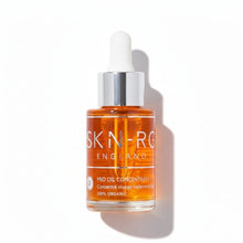 www.skin-rg.com Pro Oil Concentrate serum in a clear glass bottle with a white dropper. The amber oil is 100% organic.