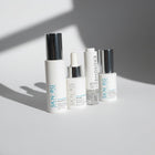 www.skin-rg.com The Reconstructor AM Dermal System, a 4-step skincare set with white bottles and silver caps.