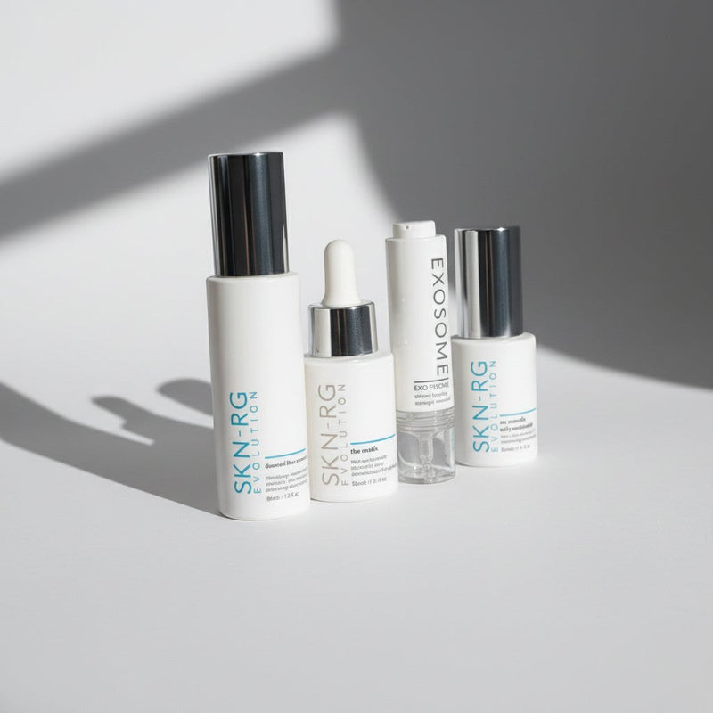 www.skin-rg.com The Reconstructor AM Dermal System, a 4-step skincare set with white bottles and silver caps.
